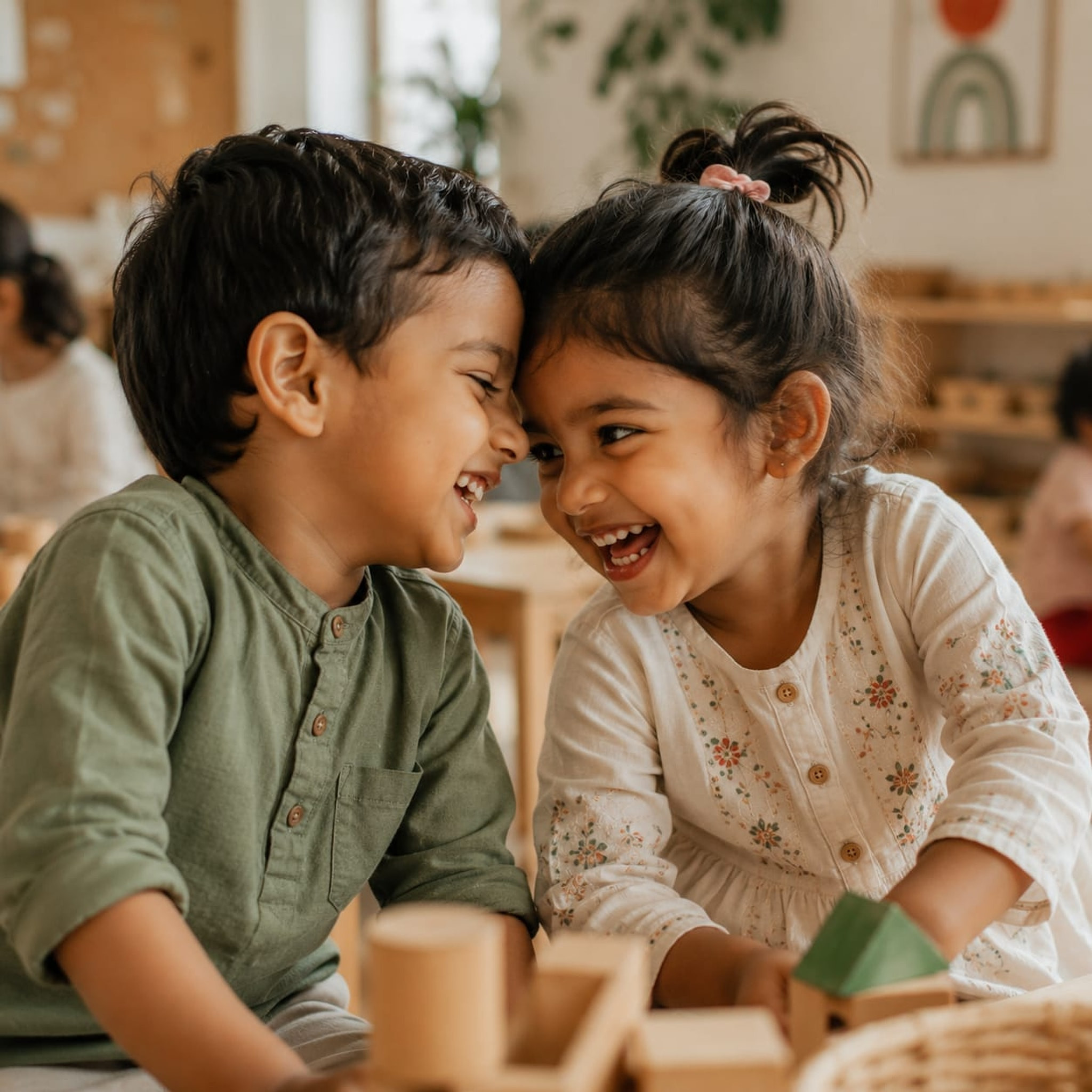 Two young friends laughing together.